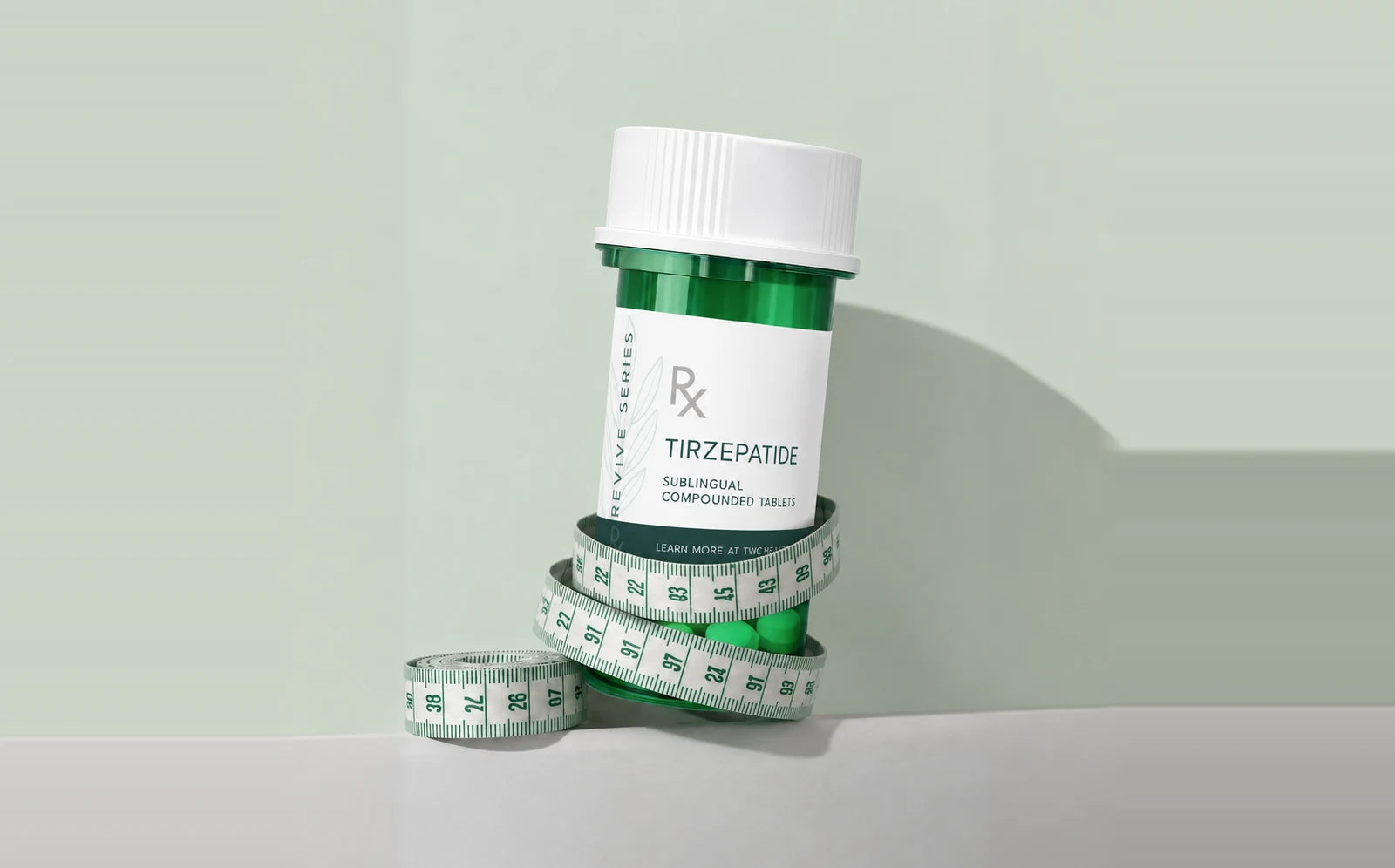 Tirzepatide sublingual tablets bottle wrapped in measuring tape