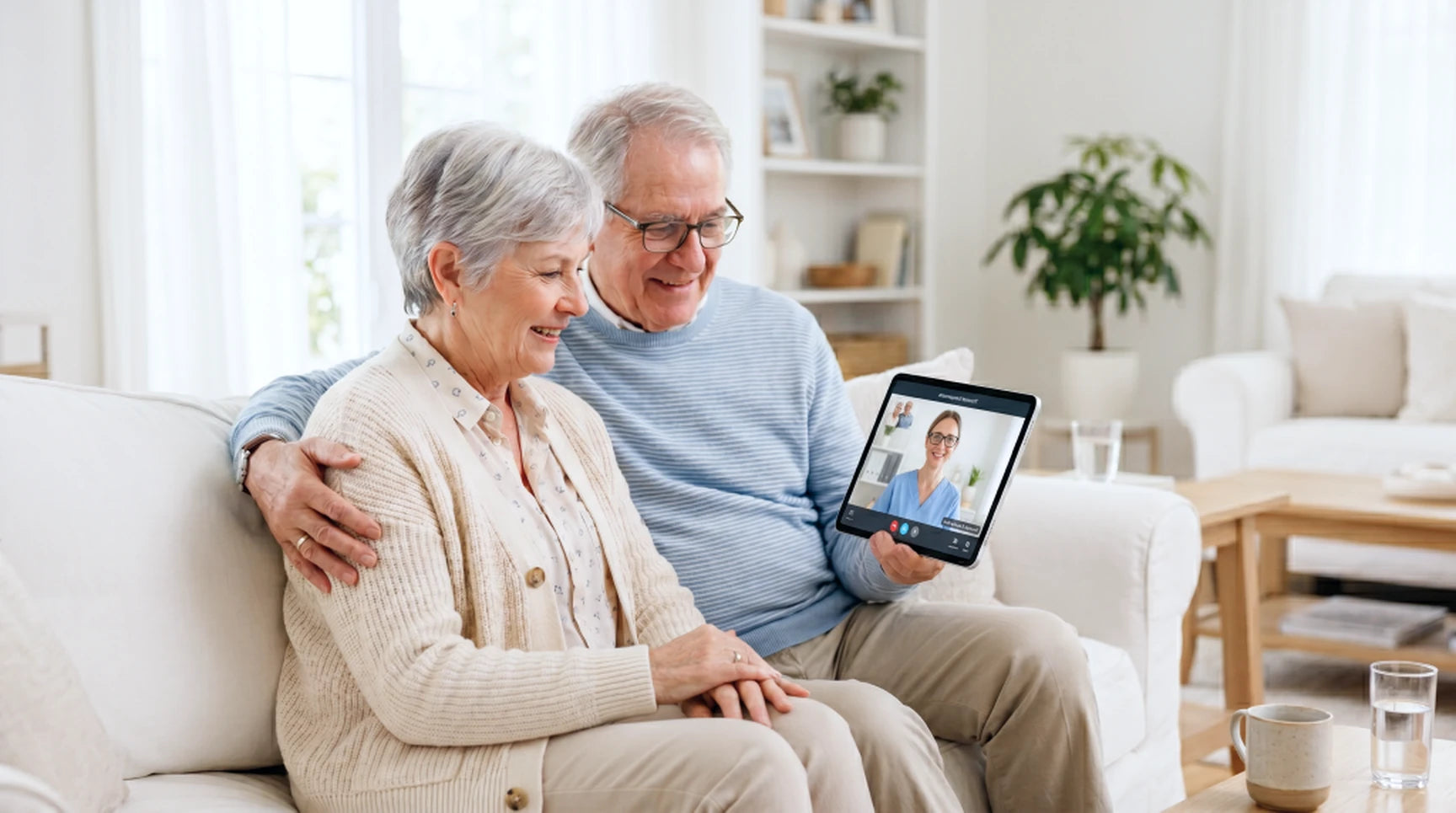 An older couple on a video call with a healthcare provider